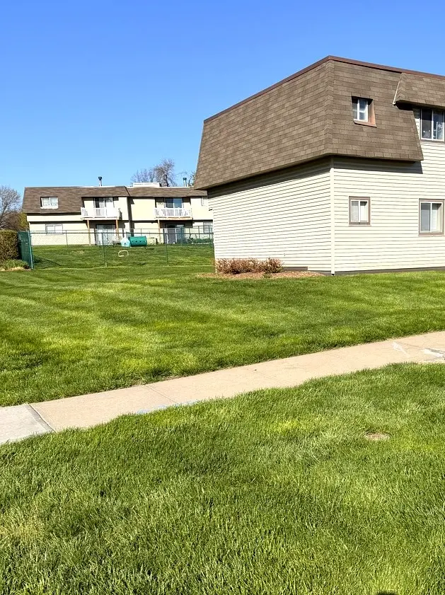 Crisp mowing lines on apartment lawn